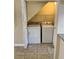 Laundry closet featuring a washer and dryer, all set on tile floor at 6232 Bayside Key Dr, Tampa, FL 33615