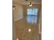 Bright living room with tiled floor and glass sliding doors to a balcony at 6232 Bayside Key Dr, Tampa, FL 33615
