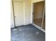 Private patio area featuring access to an exterior door and a sliding glass door entry at 6232 Bayside Key Dr, Tampa, FL 33615