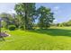 Expansive grassy backyard, offering privacy and a tranquil atmosphere at 10328 Henderson St, Spring Hill, FL 34608