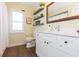 Modern bathroom with white vanity and floating shelves at 10328 Henderson St, Spring Hill, FL 34608