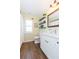 Modern bathroom with white vanity and floating shelves at 10328 Henderson St, Spring Hill, FL 34608