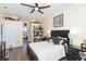 Comfortable bedroom with ensuite bathroom and built-in shelving at 10328 Henderson St, Spring Hill, FL 34608