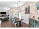 Bright dining area with wooden table and seating for four at 10328 Henderson St, Spring Hill, FL 34608