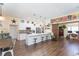 Bright white kitchen boasts an island, stainless steel appliances, and open layout at 10328 Henderson St, Spring Hill, FL 34608