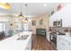 Spacious kitchen featuring modern appliances and a large island at 10328 Henderson St, Spring Hill, FL 34608