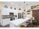 Modern kitchen with white cabinets, quartz countertops, and stainless steel appliances at 10328 Henderson St, Spring Hill, FL 34608