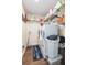 Laundry room with washer, dryer, and ample storage shelving at 10328 Henderson St, Spring Hill, FL 34608