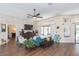 Comfortable living room featuring a stone accent wall and large windows at 10328 Henderson St, Spring Hill, FL 34608