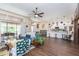 Open living space with kitchen, dining area, and hardwood floors at 10328 Henderson St, Spring Hill, FL 34608