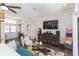 Living area with stone accent wall, hardwood floors, and comfy seating at 10328 Henderson St, Spring Hill, FL 34608