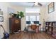 Home office with built-in bookshelves and hardwood floors at 10328 Henderson St, Spring Hill, FL 34608