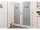 Walk-in pantry with double doors and frosted glass at 10328 Henderson St, Spring Hill, FL 34608
