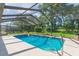 Refreshing screened pool with ample space for relaxation and fun at 10328 Henderson St, Spring Hill, FL 34608
