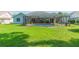 Screened pool and patio area with spacious grassy backyard at 10328 Henderson St, Spring Hill, FL 34608
