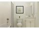 Simple bathroom with white vanity, tub, and shower at 11869 Sparkling Topaz Cv, Parrish, FL 34219