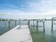 Private dock with boat lift offering water access, with picturesque water and sky views in a bright setting at 16124 4Th E St, Redington Beach, FL 33708