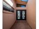 Modern entry with black double doors and glass panels at 16124 4Th E St, Redington Beach, FL 33708