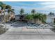 Single-story home with palm trees and brick driveway at 16124 4Th E St, Redington Beach, FL 33708