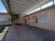 Covered patio with brick flooring and access to home at 16124 4Th E St, Redington Beach, FL 33708