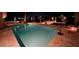 Inviting lighted pool at night with brick patio at 16124 4Th E St, Redington Beach, FL 33708