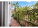 Brick pathway alongside a lush, green fence at 216 S Westland Ave # 4, Tampa, FL 33606
