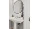 Modern bathroom with pedestal sink and oval mirror at 216 S Westland Ave # 4, Tampa, FL 33606