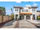 Two-story home with attached garages and a brick driveway at 216 S Westland Ave # 4, Tampa, FL 33606