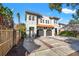Two-story home with attached garages and a wooden fence at 216 S Westland Ave # 4, Tampa, FL 33606