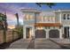 Charming townhome featuring a terra cotta roof, attached two-car garage, and welcoming front door with a wreath at 216 S Westland Ave # 4, Tampa, FL 33606