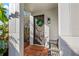Inviting front door entry with a wreath and bench at 216 S Westland Ave # 4, Tampa, FL 33606