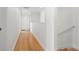 Bright hallway with hardwood floors and staircase at 216 S Westland Ave # 4, Tampa, FL 33606