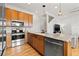 Kitchen island with granite countertop and stainless steel dishwasher at 216 S Westland Ave # 4, Tampa, FL 33606