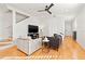 Living room with hardwood floors, neutral decor, and a large TV at 216 S Westland Ave # 4, Tampa, FL 33606