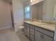Double vanity bathroom with granite countertop and walk-in shower at 36141 Welsh Glade Rd, Dade City, FL 33525