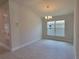Dining area with light tile floors and a chandelier at 36141 Welsh Glade Rd, Dade City, FL 33525