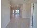 View of the foyer looking toward a bright living room at 36141 Welsh Glade Rd, Dade City, FL 33525