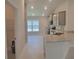Modern kitchen with gray cabinets, granite countertops, and stainless steel appliances at 36141 Welsh Glade Rd, Dade City, FL 33525