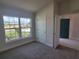 Bright spare bedroom with carpet and view of the street at 36141 Welsh Glade Rd, Dade City, FL 33525