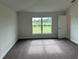 Spacious bedroom with large windows and plush carpeting at 36159 Welsh Glade Rd, Dade City, FL 33525