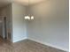 Simple dining area with hardwood floors and chandelier at 36159 Welsh Glade Rd, Dade City, FL 33525