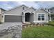Curb appeal abounds in this charming one-story home, featuring a two-car garage and attractive landscaping at 36159 Welsh Glade Rd, Dade City, FL 33525