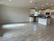 Open concept kitchen with an island and stainless steel appliances at 36159 Welsh Glade Rd, Dade City, FL 33525