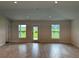 Bright and airy living room with backyard access and large windows at 36159 Welsh Glade Rd, Dade City, FL 33525