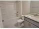 Clean bathroom with shower/tub combo and gray vanity at 36179 Welsh Glade Rd, Dade City, FL 33525