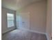 Bright bedroom with double door closet and carpeted floors at 36179 Welsh Glade Rd, Dade City, FL 33525