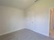 Simple bedroom with carpeted floor and neutral walls at 36179 Welsh Glade Rd, Dade City, FL 33525