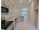 Modern kitchen with stainless steel appliances and granite countertops at 36179 Welsh Glade Rd, Dade City, FL 33525