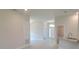 Open concept living room with tile floors and neutral walls at 36179 Welsh Glade Rd, Dade City, FL 33525
