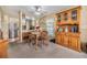 Cozy dining area with wooden table and chairs, adjacent to the kitchen at 36323 Impala Way, Zephyrhills, FL 33541